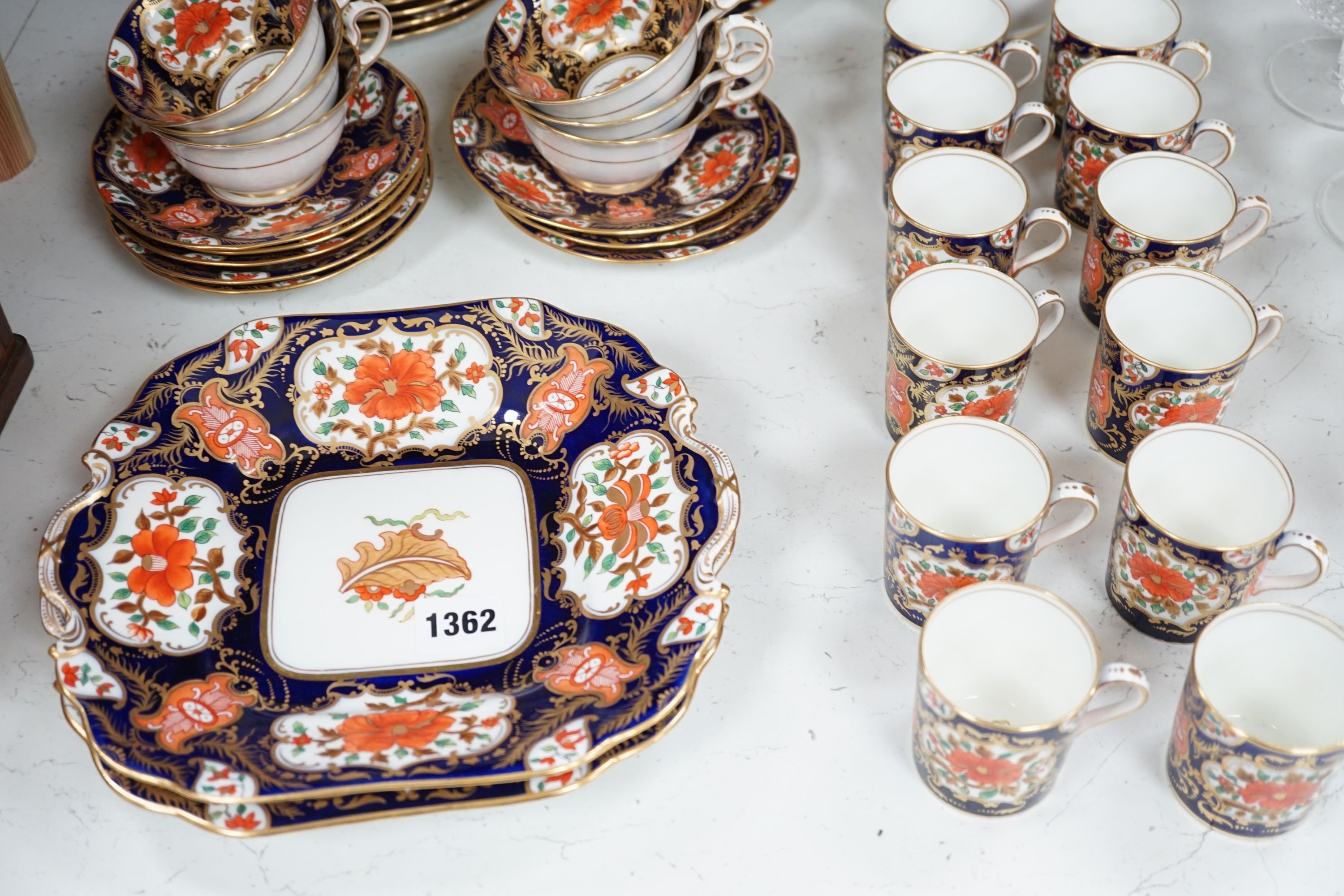 A mid 19th century English bone china fifty-two piece part tea and coffee service, decorated in an Imari pattern
